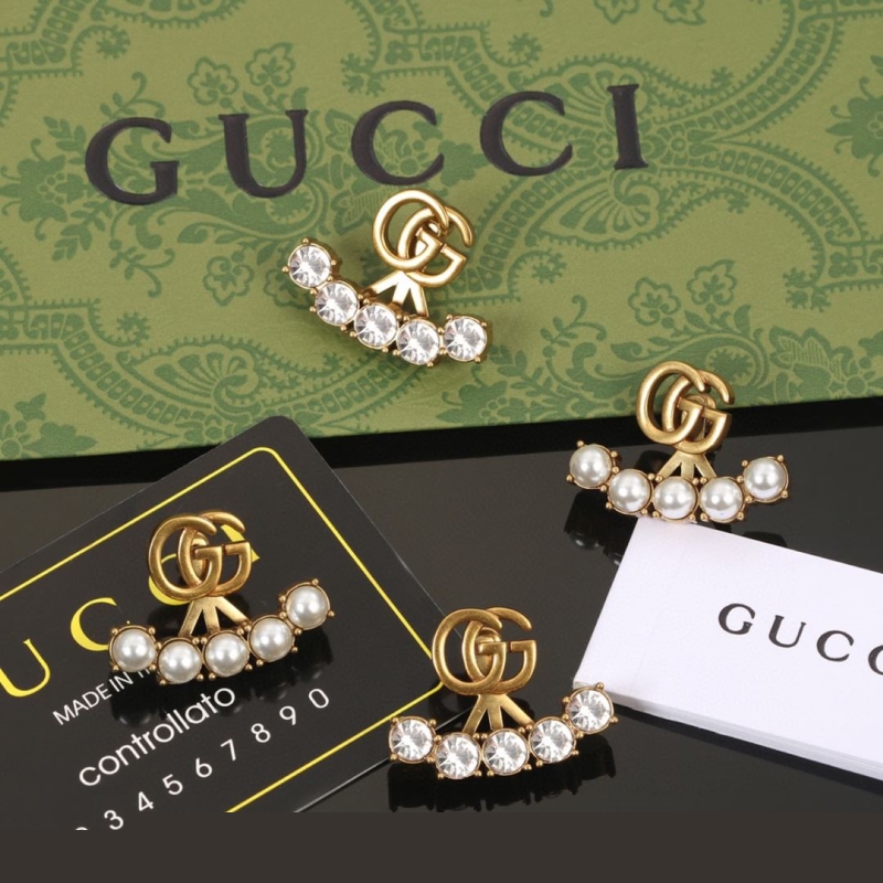 G*u*i earrings